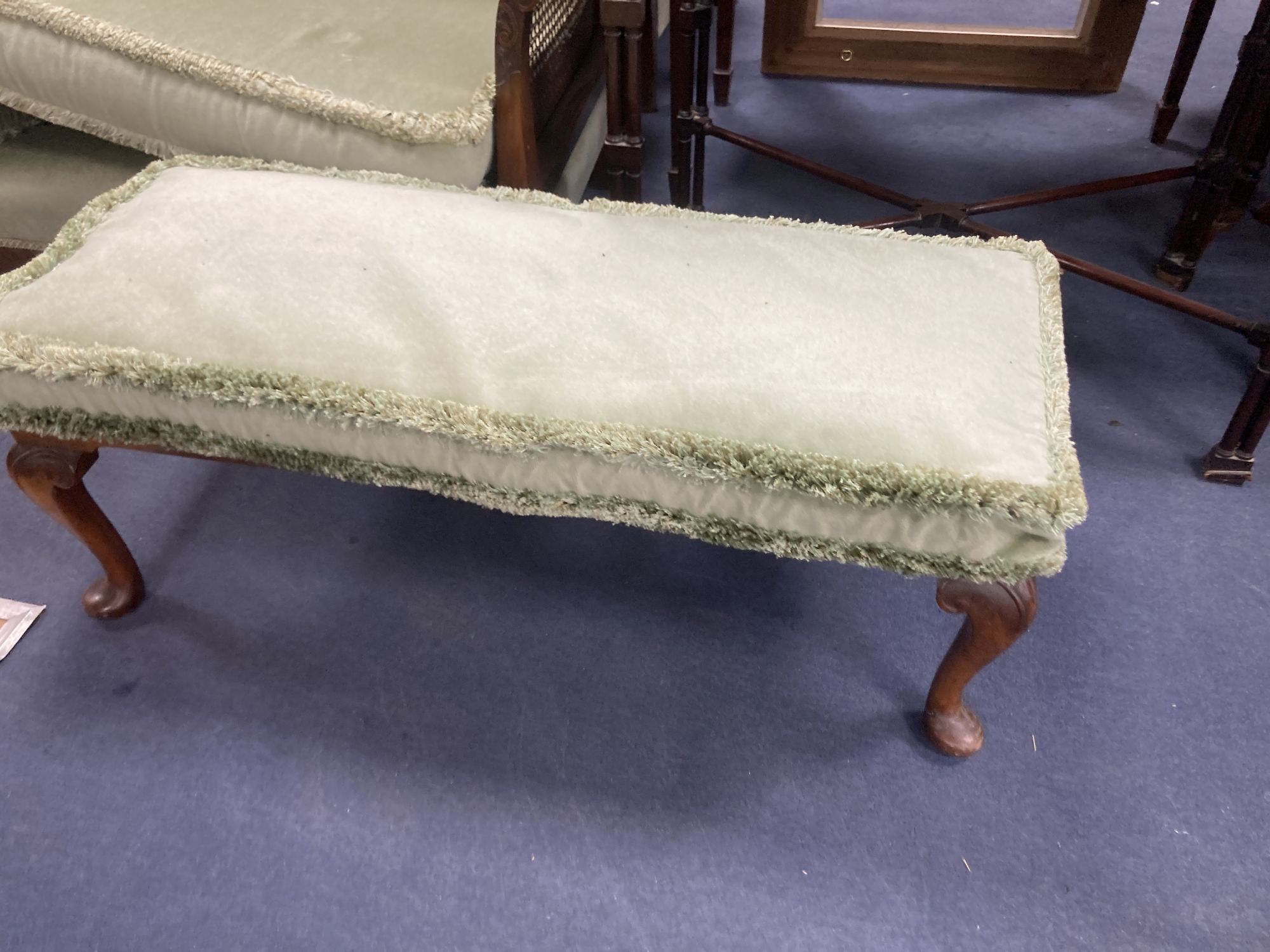 A 1920s mahogany framed three piece Bergere suite, together with a stool